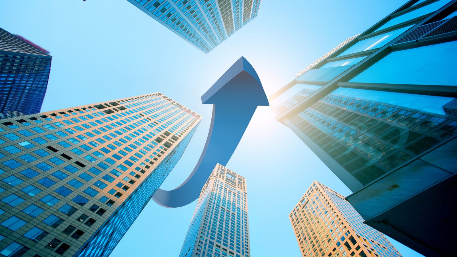 Upward view of modern skyscrapers symbolizing innovation and AI-driven transformation in strategic procurement and supply chain leadership.